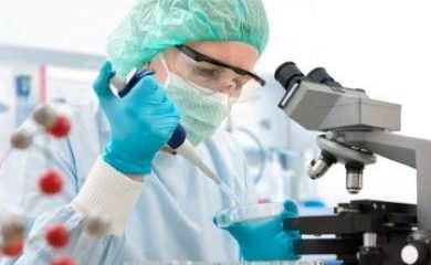 Scientist with dropper working  at the laboratory