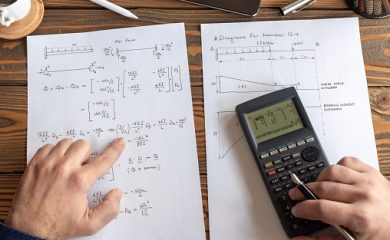 Civil Engineer or University Student Making Calculations Using Scientific Calculator